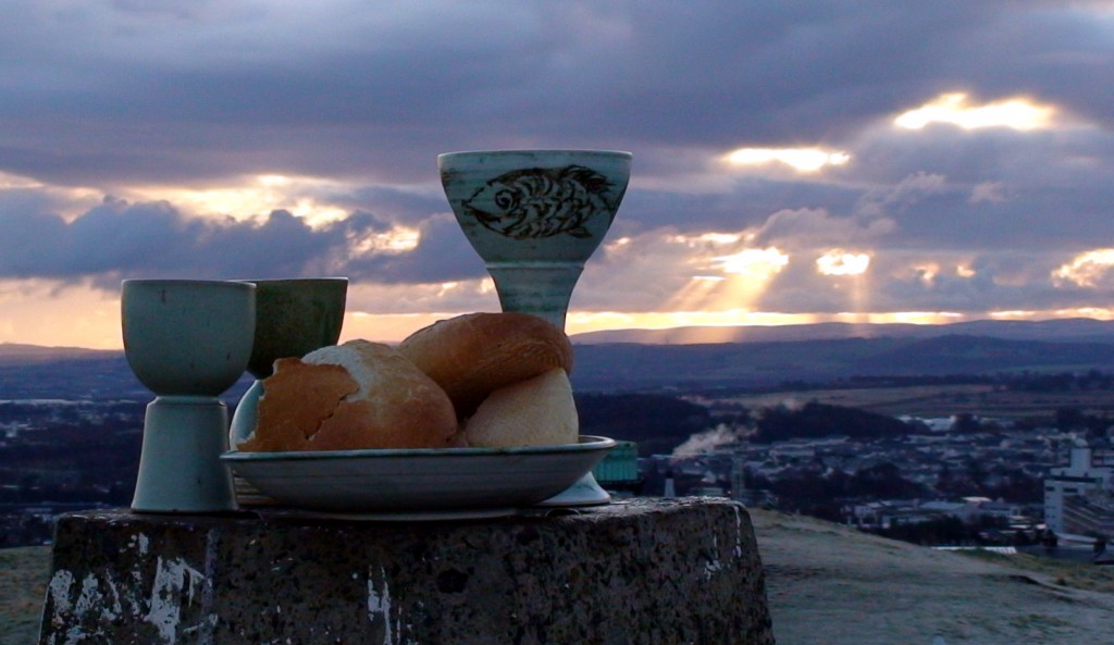 A chalice and roll sit atop the stone waypoint that marks the top of Blackford hill.