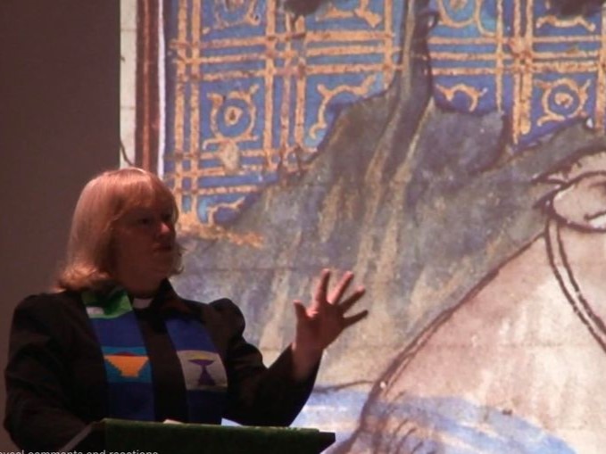 The minister is speaking during a service.