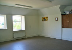 A small, bright room with a lino floor.